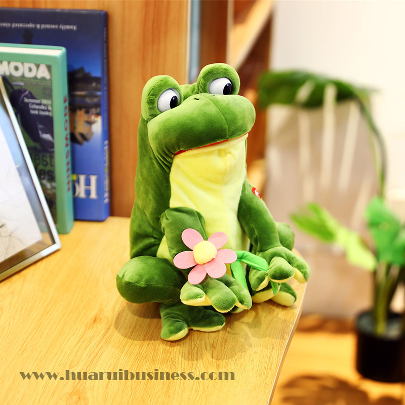 Βάτραχος με ηλεκτρικό διακόπτη, με βελούδο γάλακτος, μπορεί να κουνήσει το σώμα του και να κλείσει τα μάτια του.